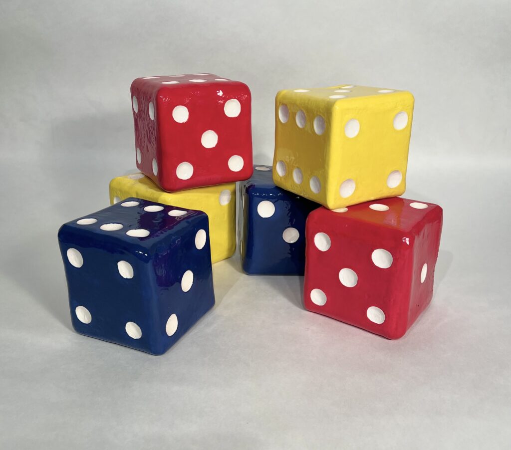 Bright ceramic dice cubes in primary colors